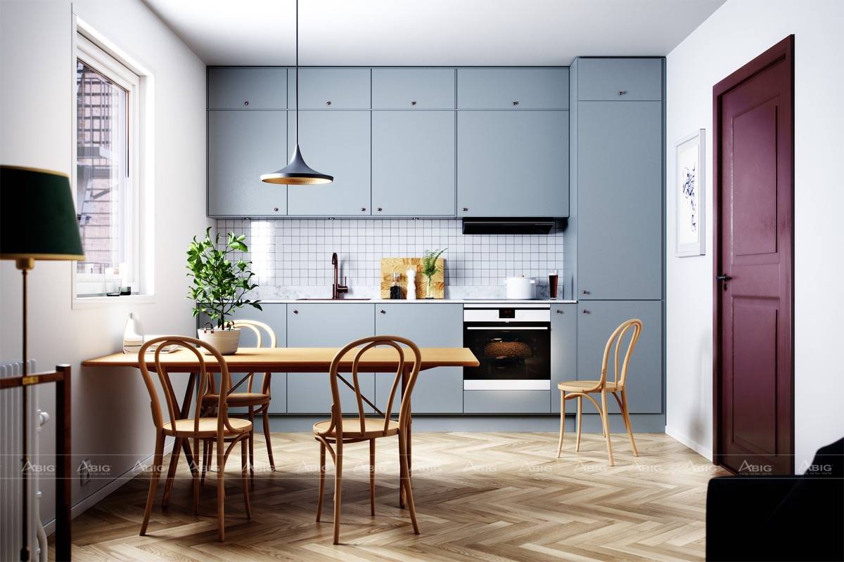 Bộ bàn ăn bằng gỗ kết hợp với tone xanh của tủ bếp tạo nên sự ấm cúng cho không gian.