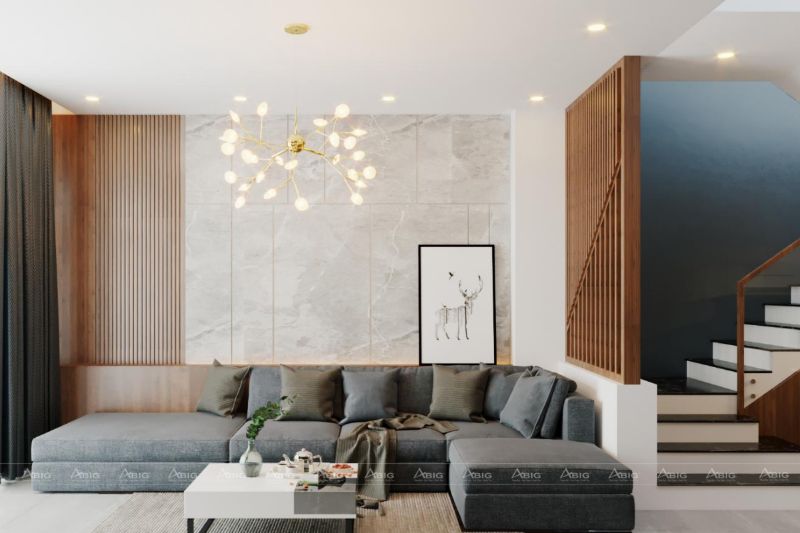 Sofa xám, đèn trần kiểu dáng mới lạ cùng bức tranh nghệ thuật cùng làm tăng vẻ sang trọng cho phòng khách